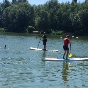 2 people on paddle boards